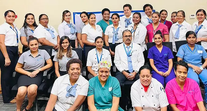 Oceania Hospital female staff in the Clinical and non-clinical areas of operations with their chief executive, Murgessan Pillay (Morgan) (seated fourth left).