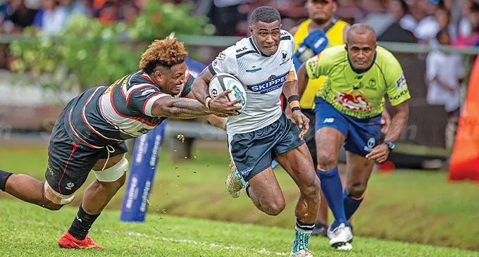 BLK Nadroga winger Ilaisa Ratuva (Jnr) runs past Naitasiri lock Te Ahiwaru Cirikidaveta to score one of trhe team's tries in their semi-final Skipper Cup match at Ratu Cakobau Park in Nausari on June 15, 2024. Photo: Leon Lord