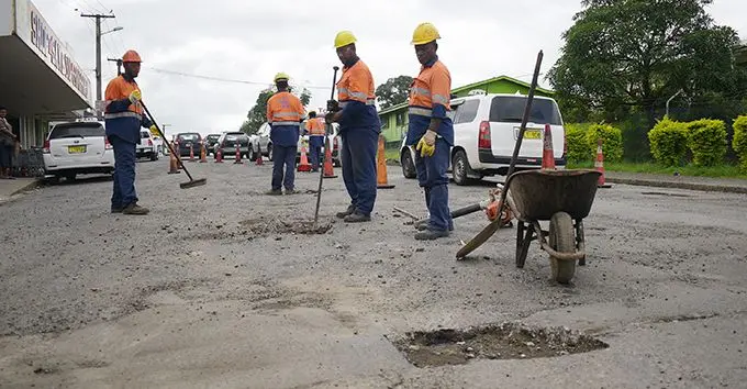 Fiji Roads Authority subcontractors mend potholes along Nasinu Road on May 11, 2020.  Photo: Ronald Kumar