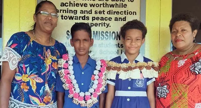 From left: Mum Bina Raj, head boy Alvin Moses, head girl Adi Malotu with her mother Vasemaca Mavoa at Waiqele Primary School.