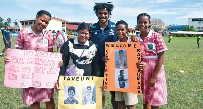 Swire Shipping Fijian Drua Selesitino Ravutaumada with Namaka Public School students, in Nadi, on May 25, 2022. Photo: Waisea Nasokia