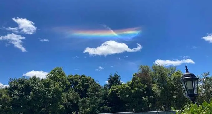 The optical phenomenon that looks like a rainbow is actually called cloud iridescence.