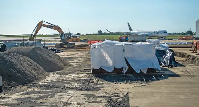 COMO Laucala Island hangar at Nadi International Airport is in its fifth year of construction, and will open when the apron is connected to the airport. The delay was owed to wrong mix of concrete that had to be dug out. Photo: Leon Lord