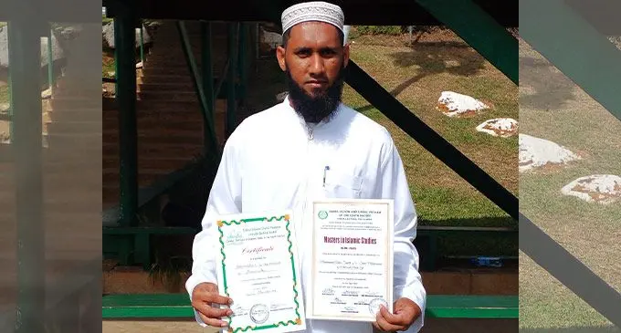 Muhammad Anas Saaleh with his certificate of completion from the Hafiz course and his Masters in Islamic Studies certificate of completion on July 9, 2022. Photo: Salote Qalubau