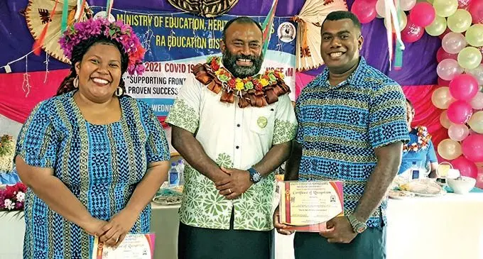 Nakorotubu Secondary School teacher Alitea Vono (first from left) and husband, Nemia Naulumatua (third from left) with the Minister for Health and Medical Services, Dr Ifereimi Waqainabete (second from left) at Rakiraki District School on December 8, 2021. Photo: Nicolette Chambers