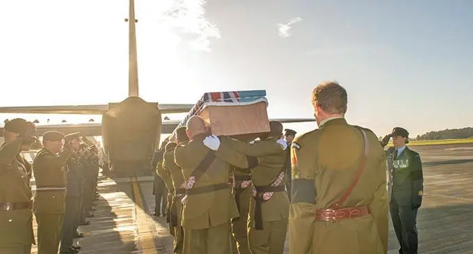 Casket of the late WO1 Vatoga being carried onto Royal New Zealand Air Force aircraft by pall bearers from the New Zealand Defence Force.  Photo: New Zealand Defence Force