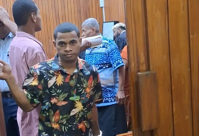 Tevita Tora (facing the camera) with second accused Leveni Vuetibau (behind him in pink shirt).