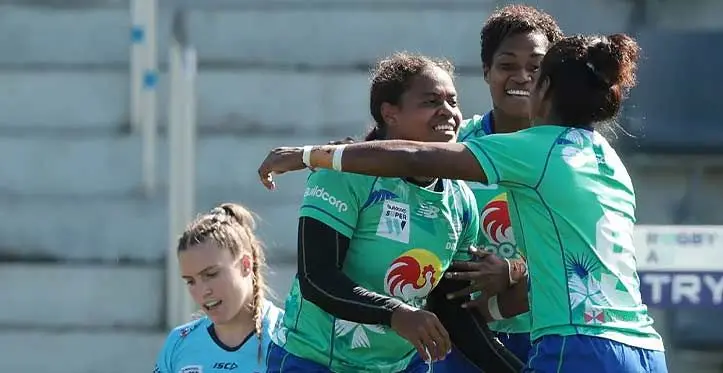 Rooster Chicken Fijiana Drua centre Vani Arei is mobbed by her team-mates Adita Milinia and Setaita Railumu after she scored the first of her two tries in the Super W semifinal against the Waratahs at the Concord Oval in Sydney, Australia, on April 30, 2023. Drua won 20-17. Photo: Rugby Australia