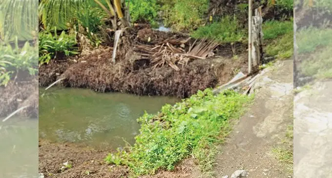 Clearing of block drain that usually cause road flood near Loa Village