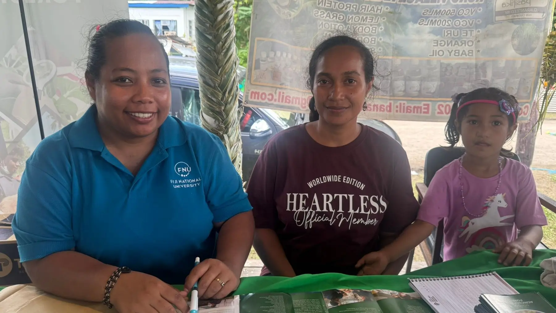 From left - Birianna Ioata, Assistant Instructor from Fiji National University’s (FNU) College of Agriculture, Fisheries and Forestry, and staff from the Ministry of Agriculture and Waterways Beren Teresia and daughter, Serenia Mark, 4, at Tabwewa village on December 17, 2025