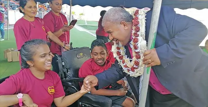 Minister for Youth and Sports Jese Saukuru (right) with two special school students at Churchill Park in Lautoka on August 2, 2023. Photo: Mereleki Nai