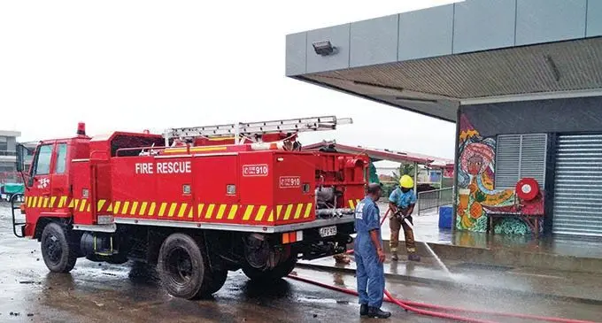 National Fire Authority officers clean up the area infront of the Rakiraki market. 