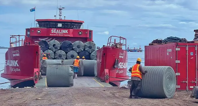 Water Authority of Fiji staff loading water tanks onto the Sealink vessel to be offloaded in Yasawa.