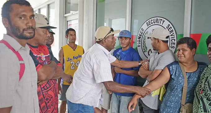 Pioneer Security Services security officers with their union representative, Eparama Ramasi (left), outside their office in Samabula after they claimed they were not paid on March 5, 2019. Photo: Ronald Kumar