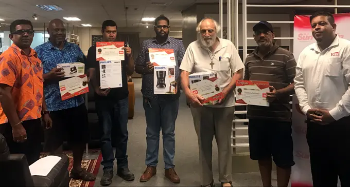 From left: Courts Samabula branch manager Bimlesh Prasad, Tomasi Boginiso, Stephen Chandra, Rishaal Kumar, Fergus Garrett, Dharmendra Kumar and  Fiji Sun marketing manager Rajiv Raju after the presenting of rewards at Courts Samabula. Photo: Selita Bolanavanua.