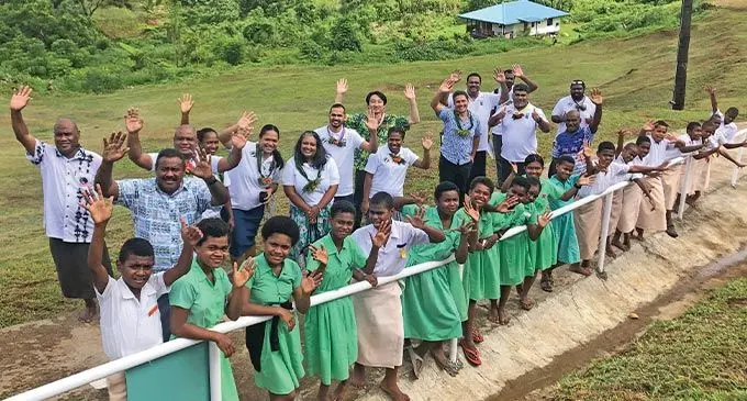 Government delegation, staff of UNDP and students at the newly constructed road access on August 5, 2022.