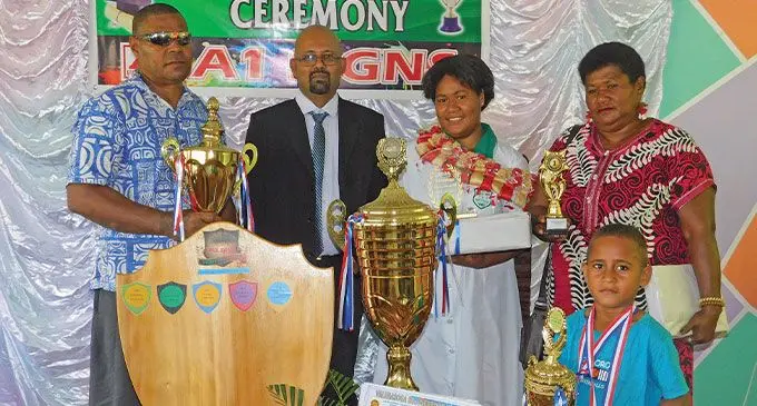 Valebasoga Secondary School dux Maraia Vuniwaqa (in garland), with her parents Waqasaqa Votuwale and Litiana Bola, nephew-Waqasaqa Votuwale Junior, and school principal Pardip Singh, during the prizegiving in Labasa on December 4, 2024.