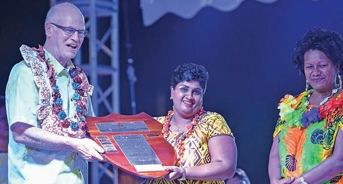 SPBD founder and president Gregory Casagrande  presenting the SPBD Woman of the Year Award to Shalini Devi . Photo: Charles Chambers 