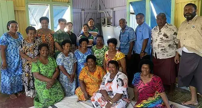 (Fourth from left) Dawn Renewable Energy Pte Limited chief executive officer Paul Huang, Pacific Islands Development Forum Intern Esme Tondreau, PIDF Director Corporate Services Sitla Sharma, Forum Co-ordinator Island Resilience Arti Chand (ninth from left), Commissioner West Mesake Ledua and (far right) District Officer Lautoka Yasawa Apisai Vularika with community members of Vio Island during the handover on July 14, 2022. Photo: Pacific Island Development Forum