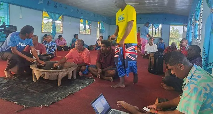 Aseri Radrodro (closest to camera) sitted amongst villagers of Naqali, Naitasiri. Photo: Wati Talebula-Nuku