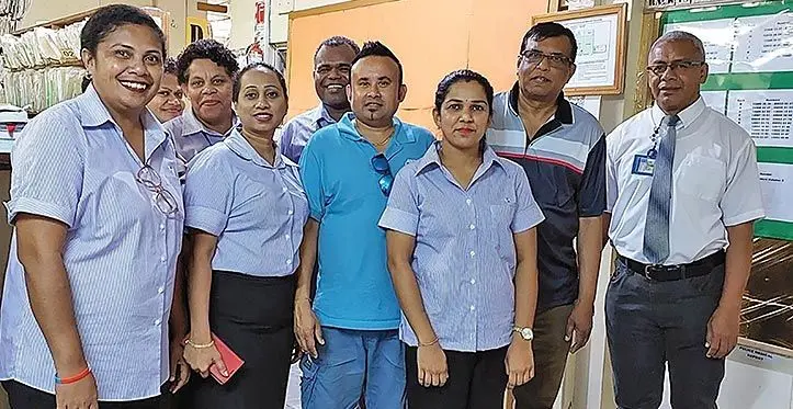 Labasa Hospital medical superintendent Doctor Jaoji Vulibeci (right) with Ravinesh Chand (middle) and Prakash Chand (beside him) as Record Department staff dressed in new uniform at Labasa Hospital on March 16, 2023.
