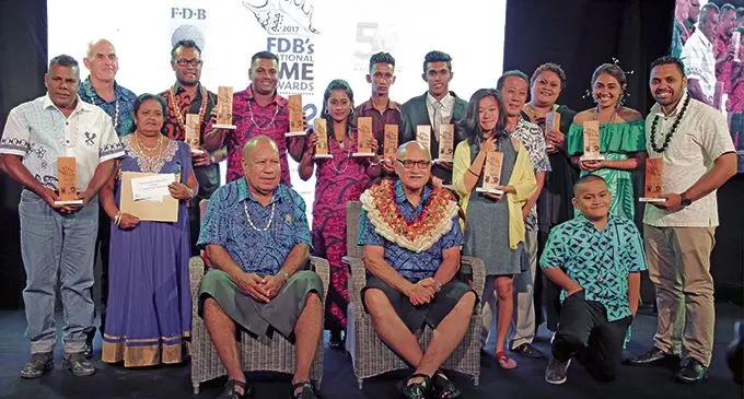 Front from left:  Fiji Development Bank Board Director Inia Naiyaga and President, Major-General (Ret’d) Jioji Konusi Konrote with the awardees of the  2017 FDB’s National SME Awards last night.  Photo: Atama Tamanilo 