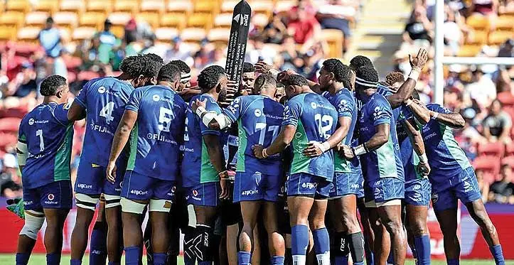 Swire Shipping Fijian Drua players huddle after doing the cibi. Photo: Fijian Drua