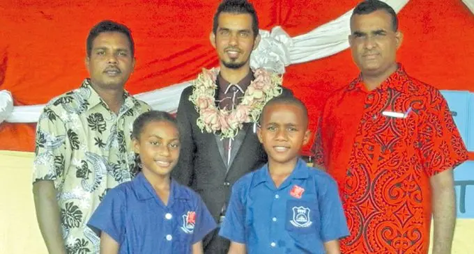 South Taveuni Primary School headgirl Lavenia Senikau with headboy LaisiasaTuibeqa after the prefect induction on Taveuni Island on February 1. (Back row from Left: School manager Krishna Reddy, chief guest Medical Officer In charge of Vuna Health Centre Mohammed  Munir and head teacher Pratosh Kumar). Photo:Supplied