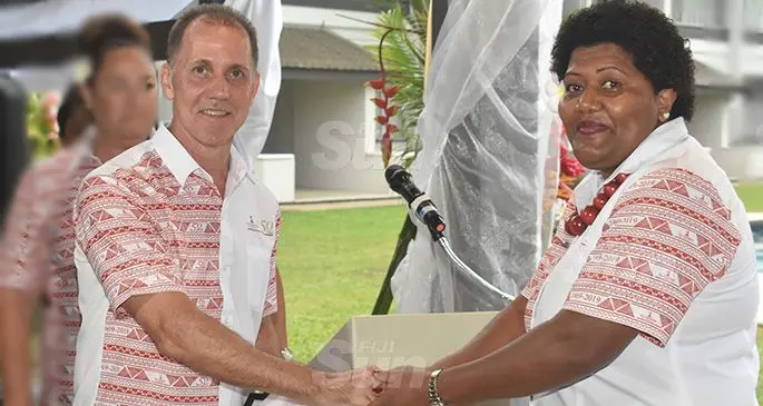 Mainaina Baleisuva, front office manageress, right, receives her award from Bradley Robinson, chief executive officer of Raffe Hotels and Resorts. Photo: Waisea Nasokia 
