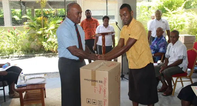 Minister for Youth and Sports, Laisenia Tuitubou, handing over the  electric scrapper to Totoya Organic Producers Network club president Tauyavu Matakitoga on February 22, 2018. Photo: Ministry of Youth and Sports   Photo: Selita Bolanavanua