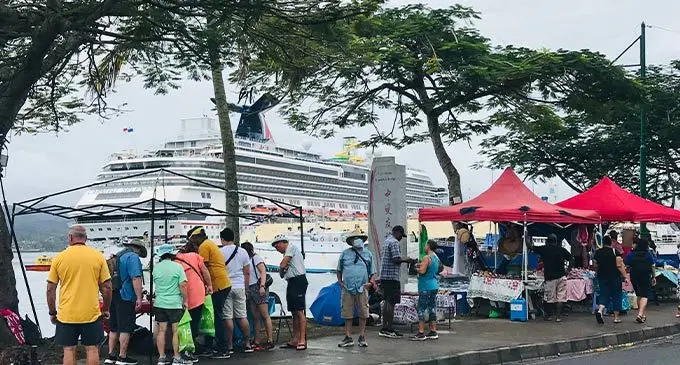 Tourists from the Carnival Splendor cruise ship visit make-shift tents along the sea-wall in Suva for a glipse of the displayed handicrafts. Photo: Laisa Lui
