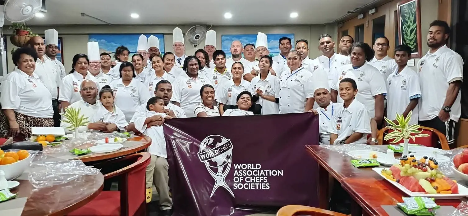 Members of the Fiji Chef Association with children of Phos Haven Children's Home. Photo: Fiji Chefs Association.