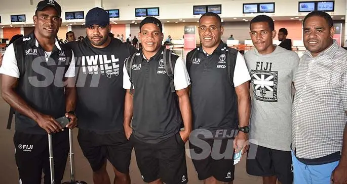 Fiji Airways Fijian 7s reps Aminiasi Tuimaba (first from left), Napolioni Ratu (third from left) and Livai Ikanikoda (fourth from left) with fans at the Nadi International Airport on January 20, 2020. Photo: Waisea Nasokia