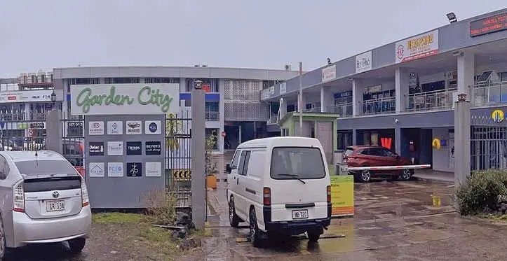 Garden City complex in Suva. Insert photo: A woman approaches Marco Polo outlet inside Garden City. Photos: Maraia Vula
