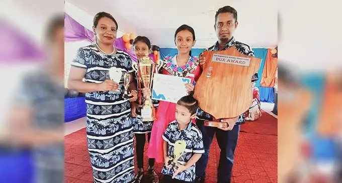 From left, Sharon Mala (mother), Esha Raina (sister), Ashie Raina, Divansh Chand (brother) and Deepak Chand (father) during her graduation last week.