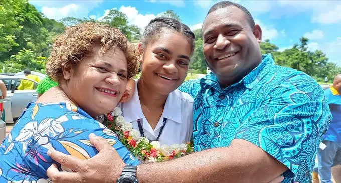 Proud parents Miriama Kalokalo (left) and Staff Sergeant Paula Kabakoro, with daughter and head girl of the Christian Mission Fellowship College, Alumeci Kabakoro, after the school’s prefect induction on February 28, 2023. Photo: Ronald Kumar