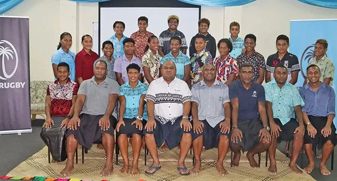 The Fijiana 7s team and officials, sitting from left: Ivamere Nabura, Tikiko Namaua (strength and conditioning coach), Rusila Nagasau (captain), Fiji Rugby Union chairman Humphrey Tawake, head coach Saiasi Fuli, assistant coach Timoci Volavola, manager Apenisa Nasilasila and physiotherapist Josua Mataitoga at the Pacific Theological College, Nasese, on April 19, 2022. Photo: FRU Media