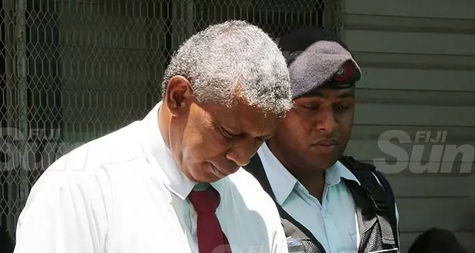 Fatai Peni escorted by Police at the Nasinu Court on January 2, 2020. Photo: Kelera Sovasiga