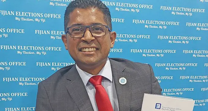 Supervisor of Elections Mohammed Saneem with a copy of the candidates handbook on April 25, 2022.  Photo: Wati Talebula-Nuku