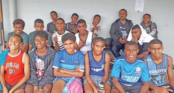 Josua Lesubula (sitting fourth from left on the last row) with athletes of Vunisea Secondary School from Kadavu at the HFC Bank Stadium, Suva on August 13, 2022. Photo: Sereana Salalo