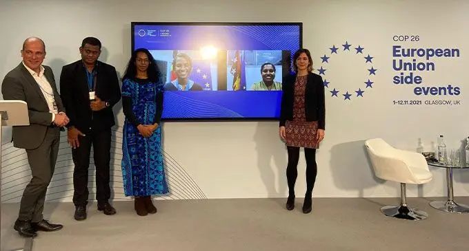 Sevuloni Rokomatu of the International Federation of Red Cross and Chair of Pacific Resilience Partnership (PRP) Youth Working Group (second from left) and Davila Talemaimaleya, a Fijian youth climate activist at the EU pavilion, Scottish Exhibition Campus, Glasgow