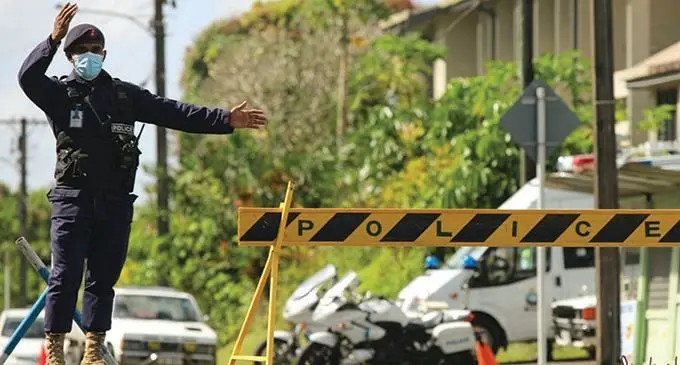 A Police officer outside the mortuary at the Colonial War Memorial Hospital in Suva after they cordoned it off due to the movement of people around the area on July 21, 2021. Photo: Fiji Police Force 