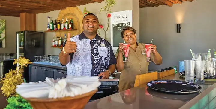 Cocktails at sunset are a must at Lomani Island Resort & Spa .