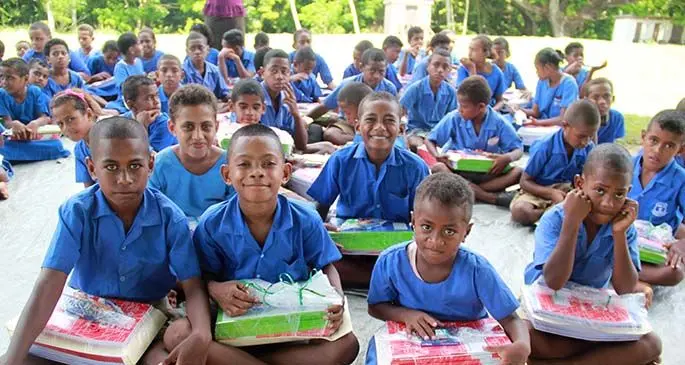 Students of Somolevu Catholic Primary School in the Yasawa Group after receiving their back-to-school packs.