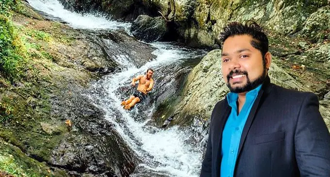 Waitavala waterslide in Taveuni in the background with Mr Azel Raj on the right hand side.