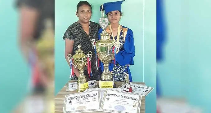 Komal Naidu with daughter Kavita with the dux trophies. Photo: Waisea Nasokia