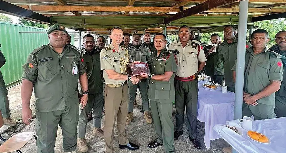 Australian Defence Advisor Colonel Henry Stimson with the Republic of Fiji Military Forces (RFMF) 3FIR personnel at the Queen Elizabeth Barracks, Nabua. Photo: RFMF Media Cell