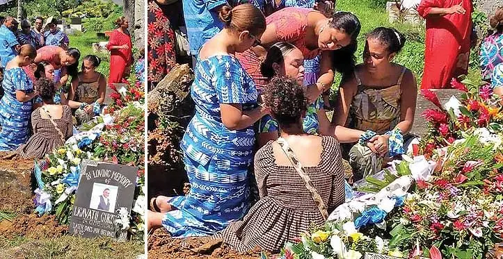 The late Ligavatu Gukisuva’s daughter Helga Gukisuva consoled by loved ones beside her father’s grave on April 19, 2023.