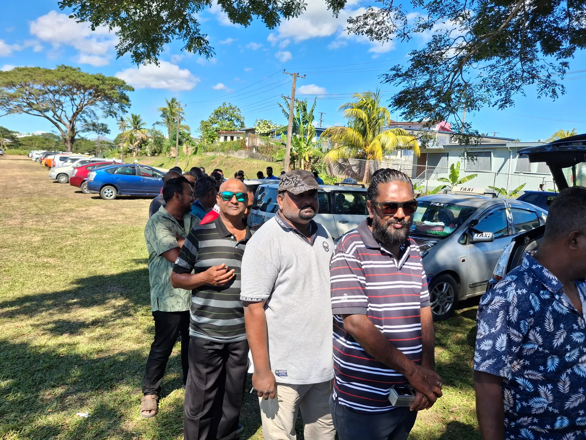 Taxi drivers line up in Lautoka to have their taxi meters reset and calibrated, ensuring compliance with current fare regulations and accurate charges for passengers.