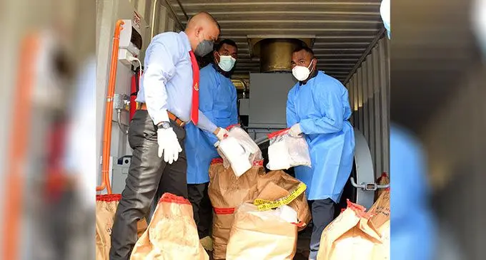 Police officers while burning and disposing AU$33 million worth of cocaine at Nakasi, Nausori on July 28, 2022. Photo: Ronald Kumar